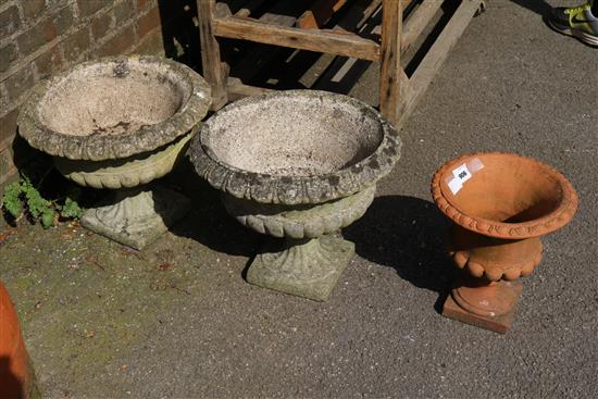 Pair of garden urns and another
